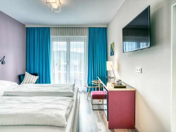 Dreibettzimmer mit Balkon