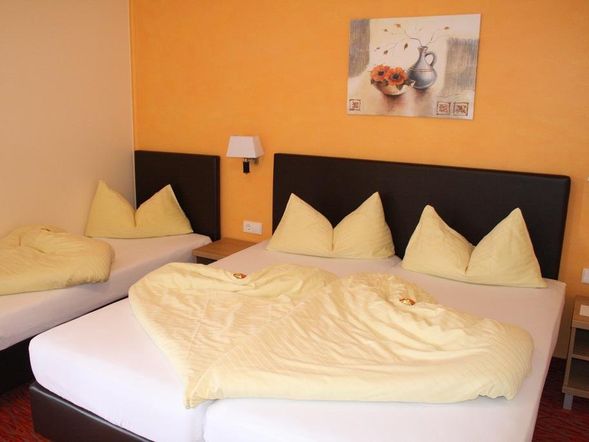 Dreibettzimmer mit Balkon