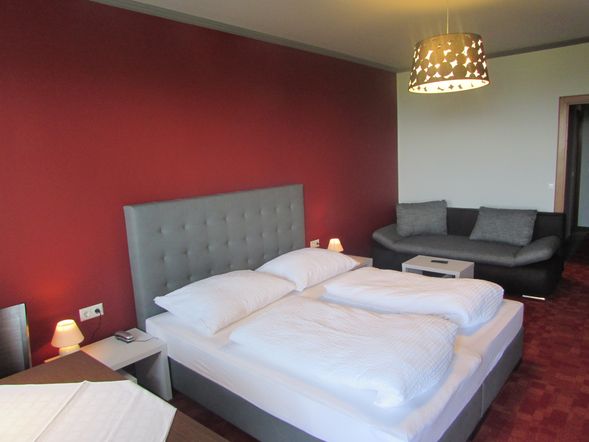 Dreibettzimmer mit Balkon